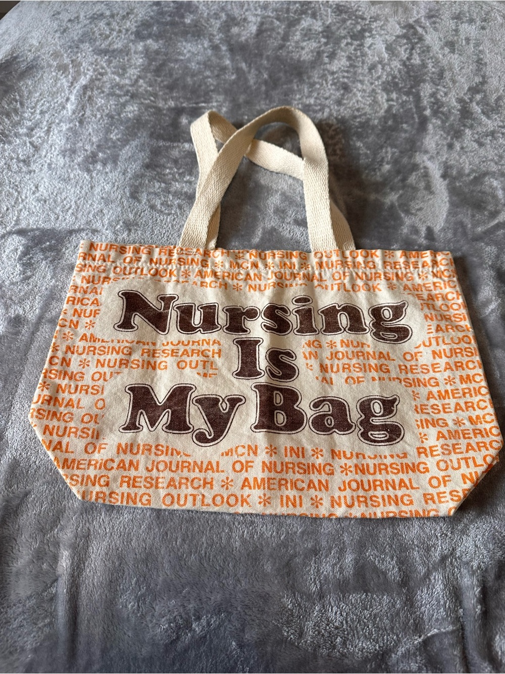 Vintage Nursing Is My Bag Canvas Tote in Cream with Brown and Orange text Use